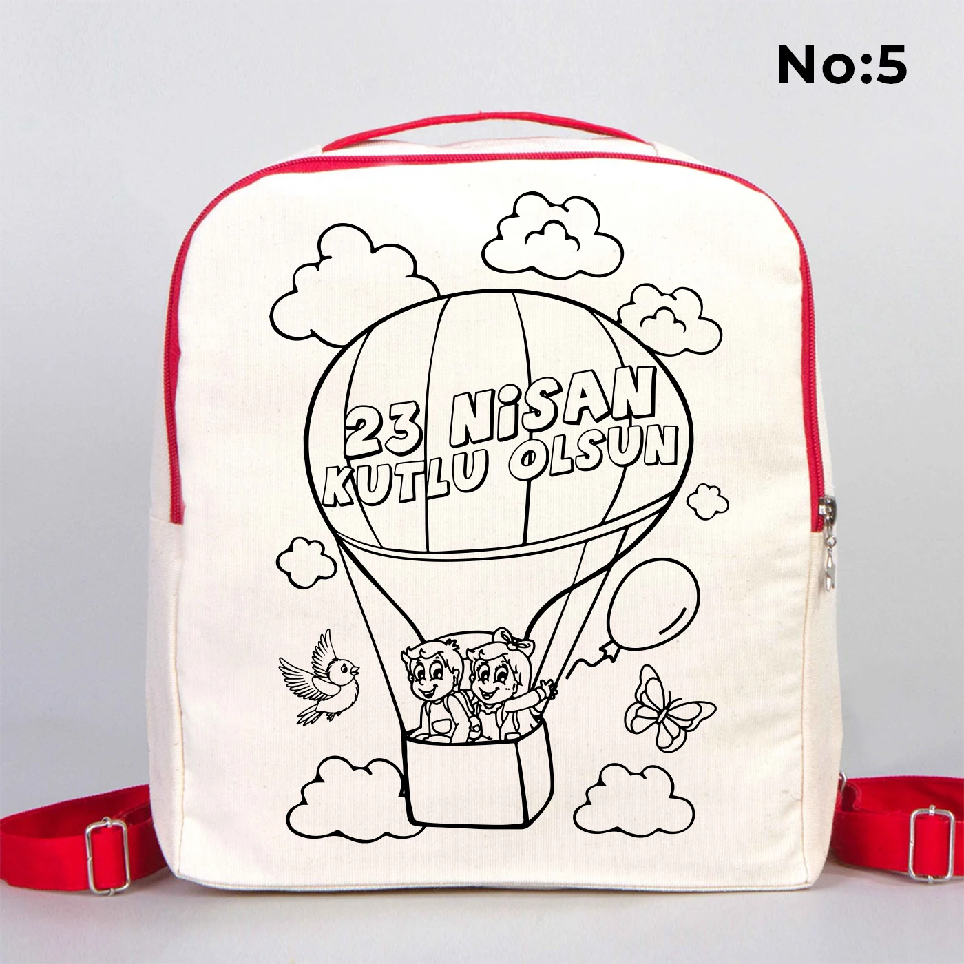25x32x10 cm krem renkli kırmızı fermuar ve askı detaylı çocuk sırt çantası üzerinde boyamaya uygun “23 Nisan Kutlu Olsun” yazılı siyah beyaz baskı