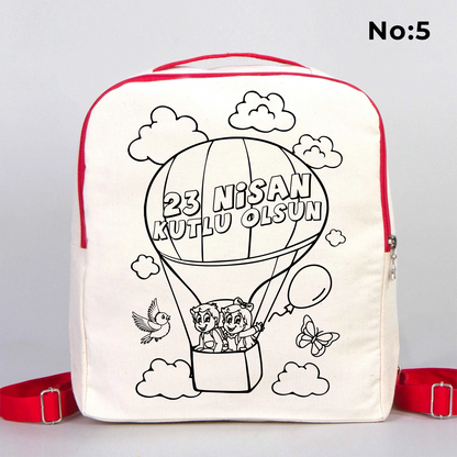 25x32x10 cm krem renkli kırmızı fermuar ve askı detaylı çocuk sırt çantası üzerinde boyamaya uygun “23 Nisan Kutlu Olsun” yazılı siyah beyaz baskı