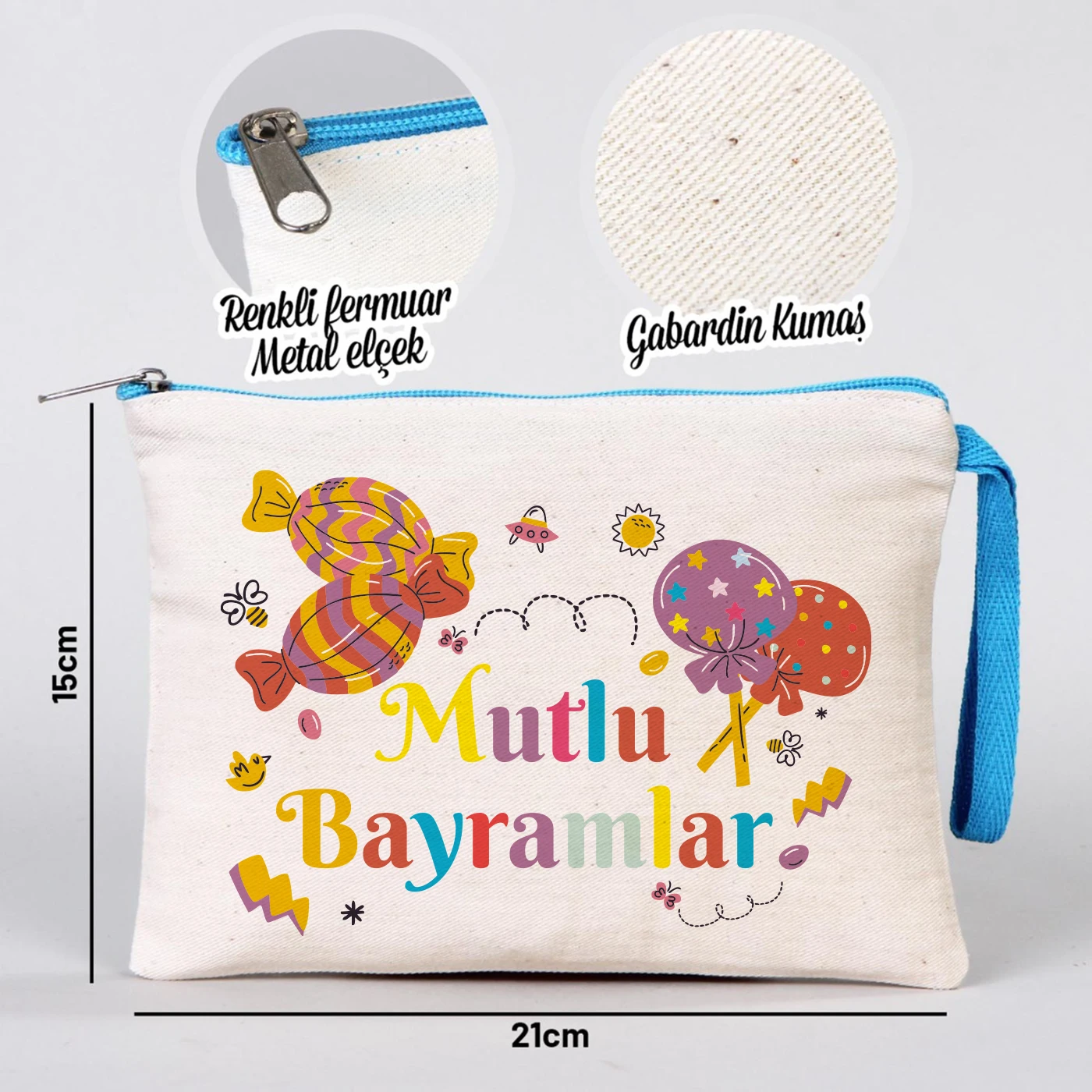 Krem kanvas 21x15 cm elde taşınabilir clutch, turkuaz fermuarlı, “Mutlu Bayramlar” yazısı ve şeker motifleri bulunan Bayram hediye çanta