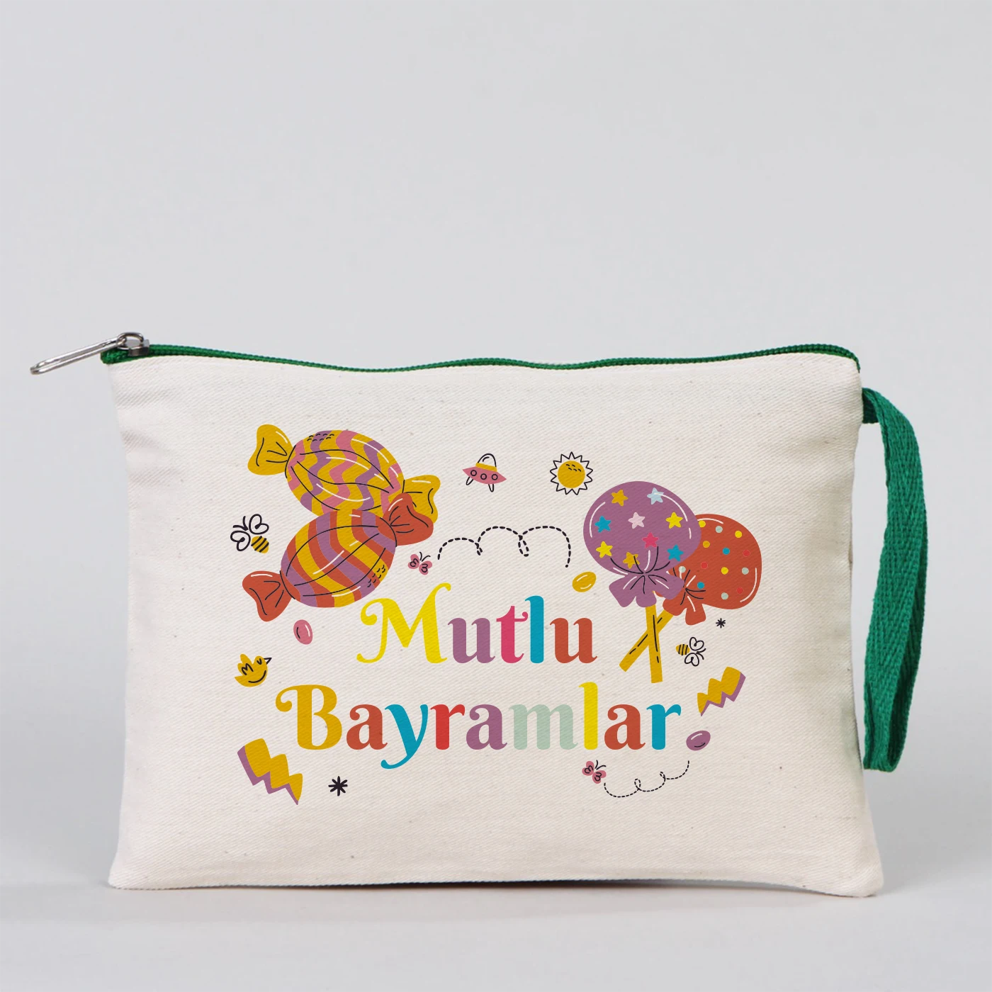 Krem kanvas 21x15 cm elde taşınabilir clutch, yeşil fermuarlı, cami figürlü “Mutlu Bayramlar” yazılı Bayram hediyelik çanta.