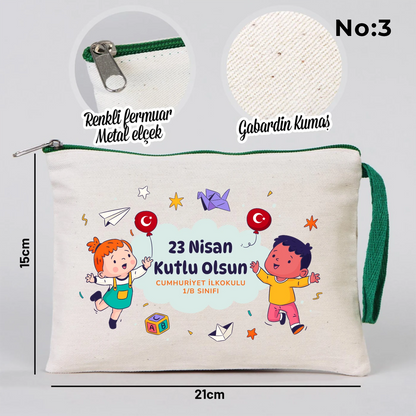 23 Nisan temalı 21x15 cm fermuarlı bez kalemlik üzerinde gökkuşağı, güneş ve uçaklı çocuk illüstrasyonu ile “23 Nisan Kutlu Olsun” yazısı ve okul - sınıf özelleştirilebilir alan.