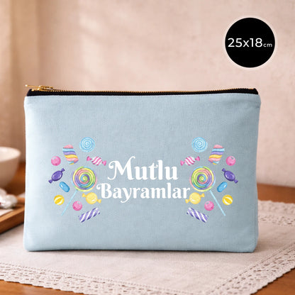 25x18 cm mavi kanvas clutch çanta, siyah fermuarlı, şeker desenli “Mutlu Bayramlar” baskılı
