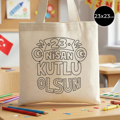 23x23 cm krem renkli bez çanta üzerinde boyamaya uygun “23 Nisan Kutlu Olsun” yazılı siyah beyaz baskı ve sınıf temalı arka plan
