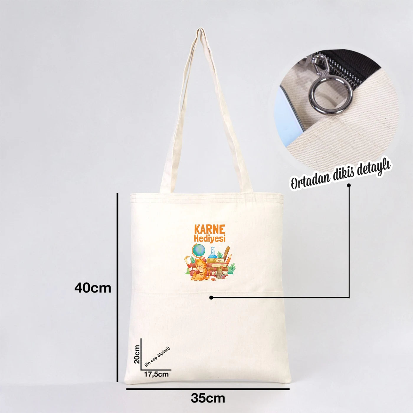 35x40 cm ham renk gabardin bez çanta, 70 cm saplı ve ön ceplere sahip.