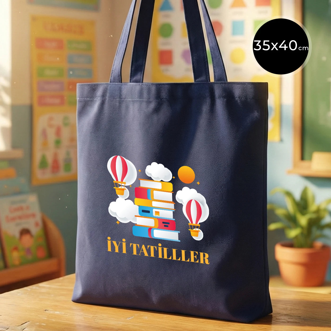 Navy blue 35x40 cm gabardine cotton tote bag with 70 cm handles, non-gusseted, standing upright on a desk in a warm, colorful classroom setting.